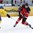 ZUG, SWITZERLAND - APRIL 23: Canada's Jansen Harkins #12 lets a shot go while Sweden's Jonathan Leman #8 defends during quarterfinal round action at the 2015 IIHF Ice Hockey U18 World Championship. (Photo by Francois Laplante/HHOF-IIHF Images)